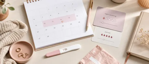 Premium editorial Doola Learn hero image with calm visual cues for implantation bleeding vs period.