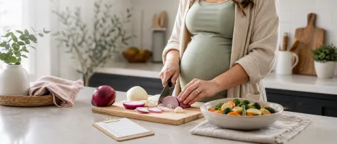 Pregnancy-safe kitchen scene with washed red and white onions being sliced on a clean cutting board.